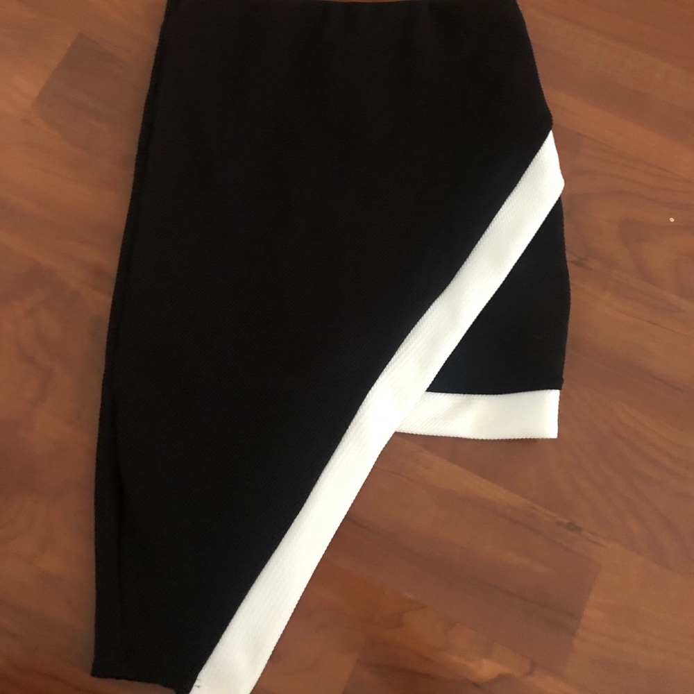 Papaya. Asymmetrical tight skirt.
